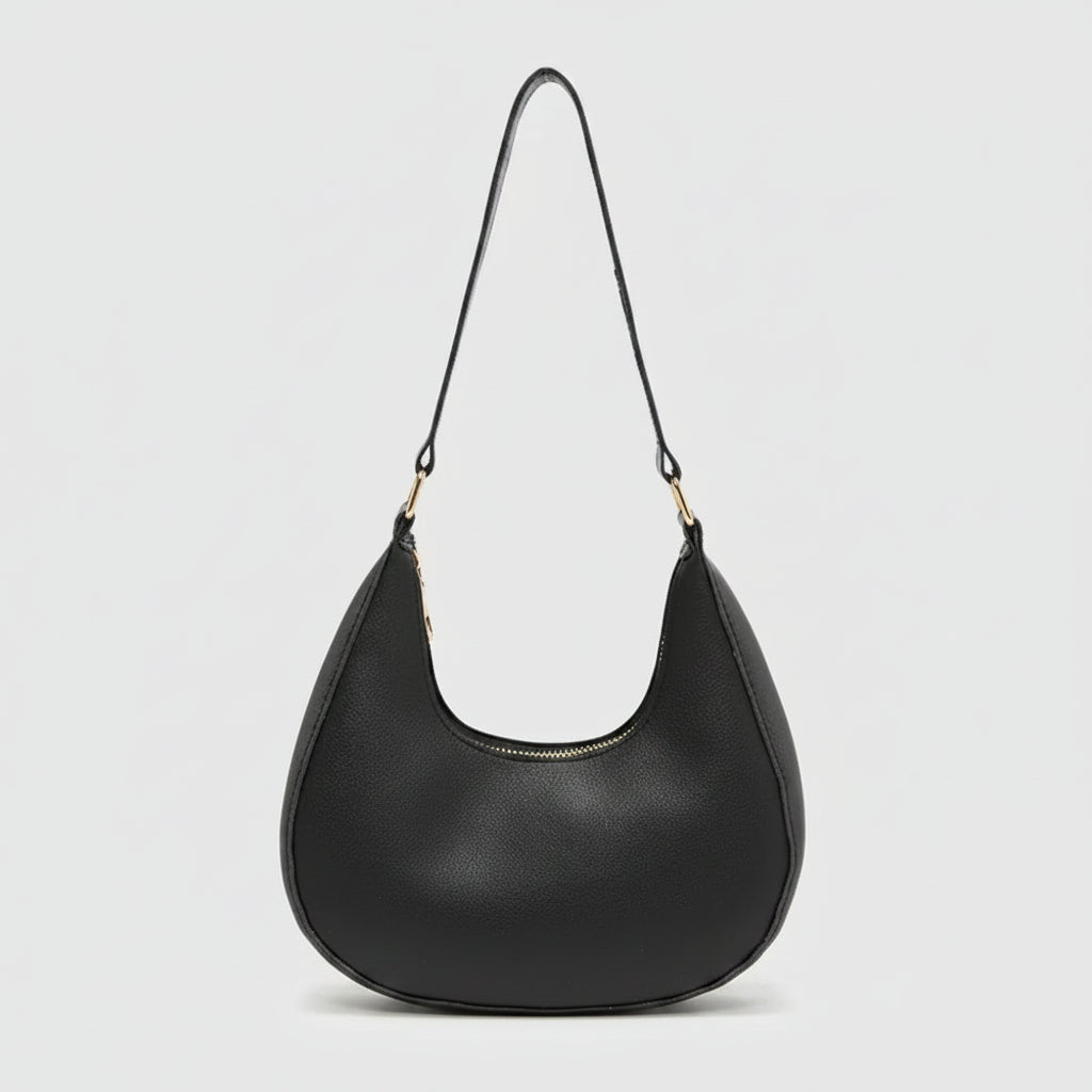 A black crescent-shaped shoulder bag with a single thin strap and gold-tone hardware, shown against a plain white background.
